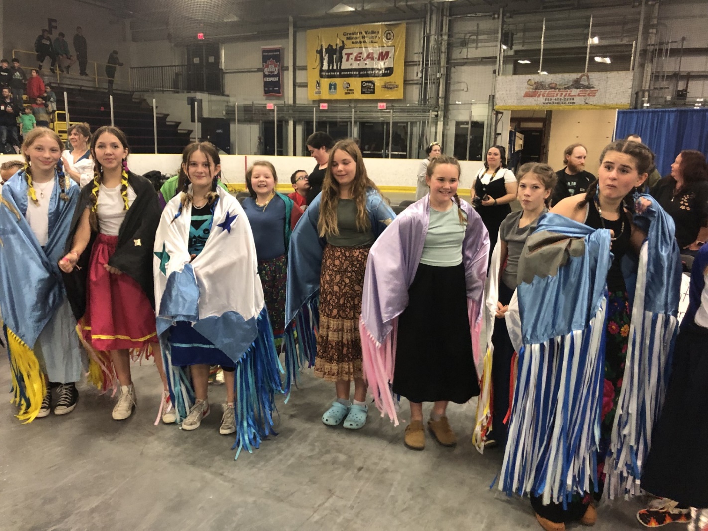A group of people posing for a photo
Description automatically generated