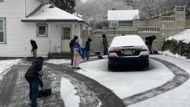 Trafalgar Students shovelling driveways
